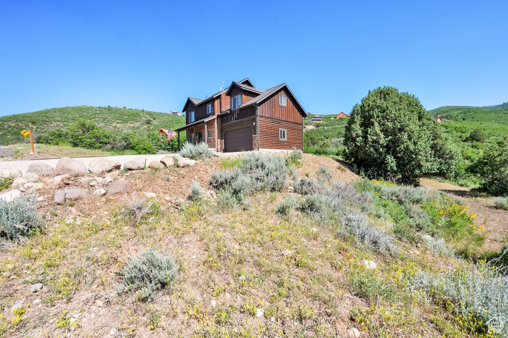 View of property exterior with board and batten siding