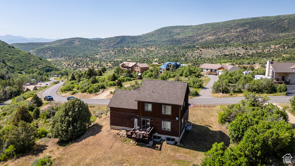 View of subject property featuring mountains