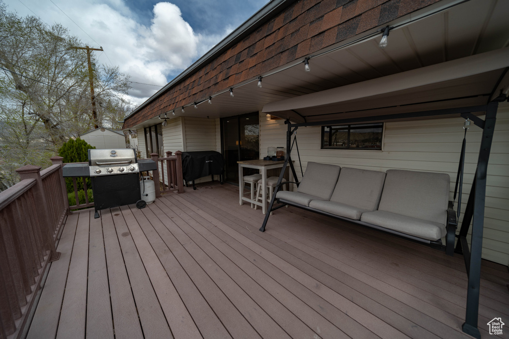 Deck with grilling area and an outdoor hangout area