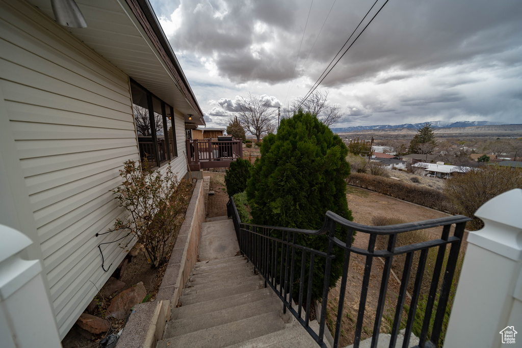 View of side of property with a mountain view