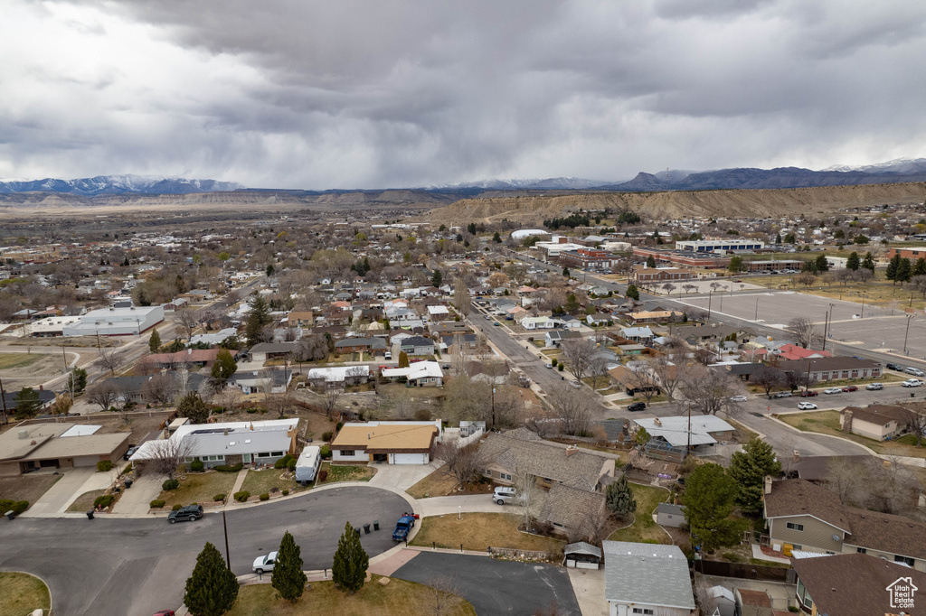 Drone / aerial view with a residential view and a mountain view