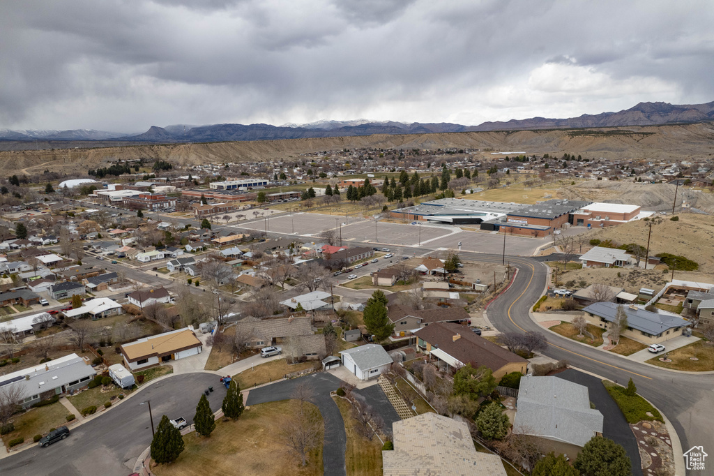 Birds eye view of property with a mountain view and a residential view