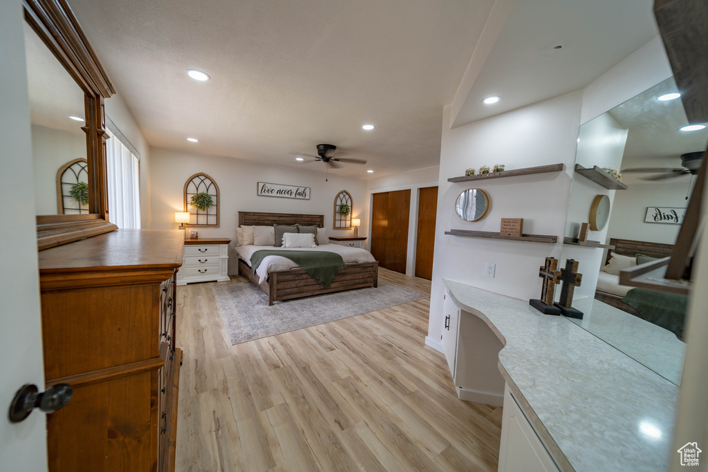 Bedroom featuring light wood-style flooring, recessed lighting, and a ceiling fan