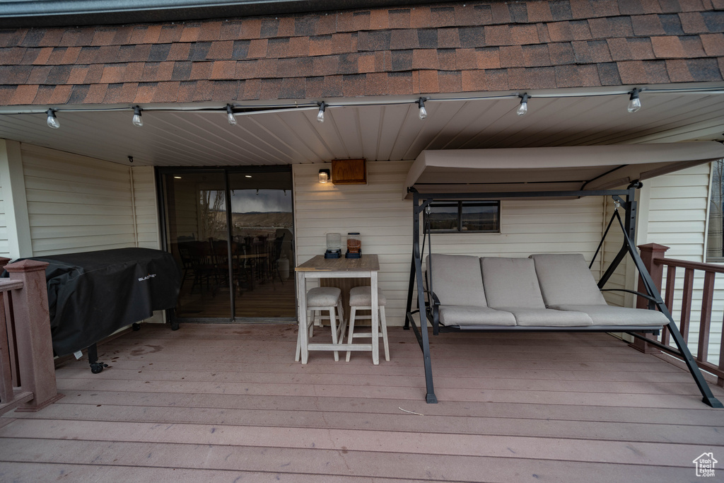 Wooden terrace with a grill