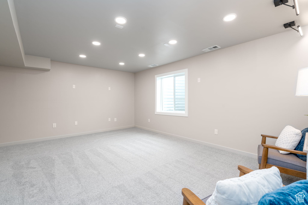 Sitting room with carpet flooring, visible vents, baseboards, and recessed lighting