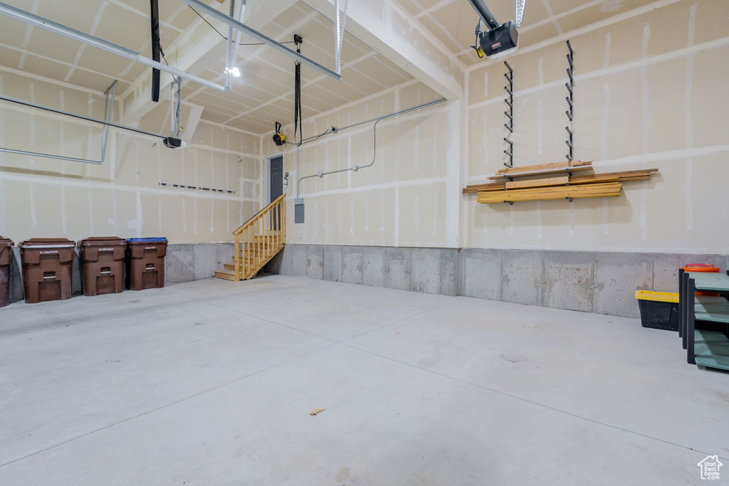 Garage featuring a garage door opener