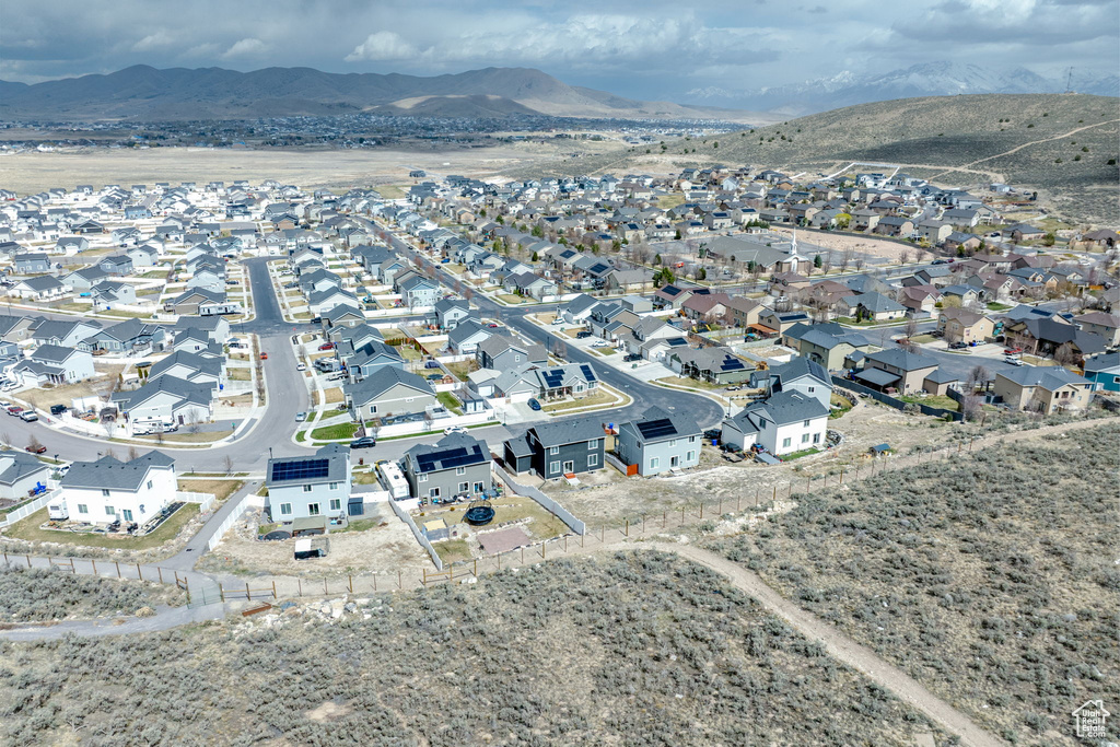 Birds eye view of property with a residential view and a mountain view