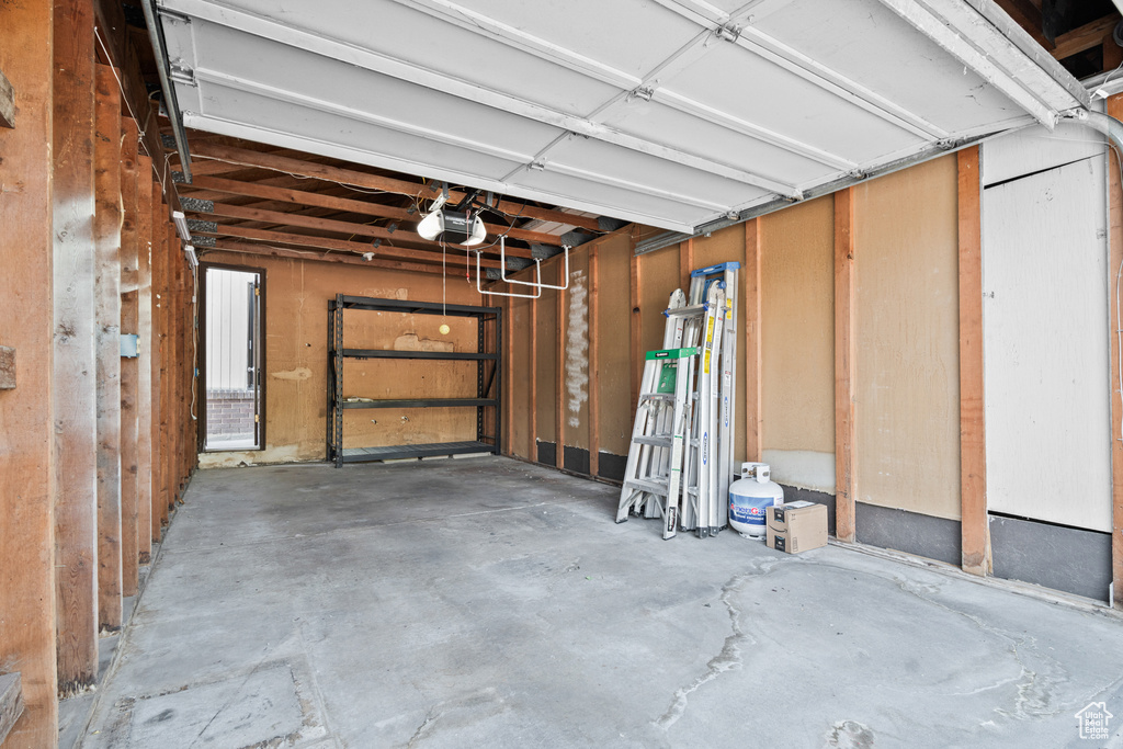 Garage featuring a garage door opener