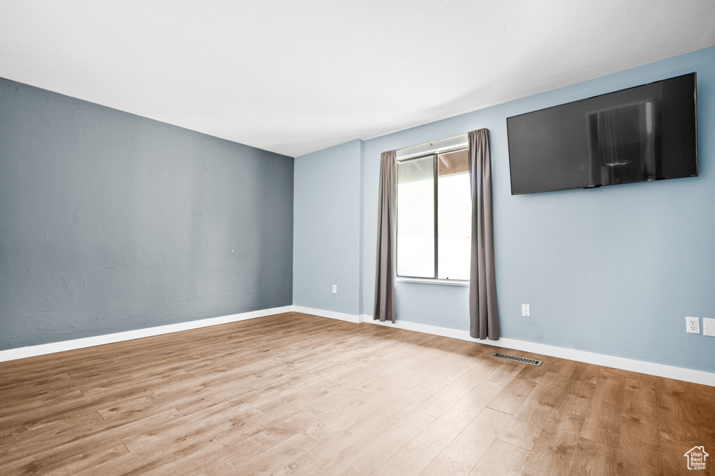 Empty room with wood finished floors