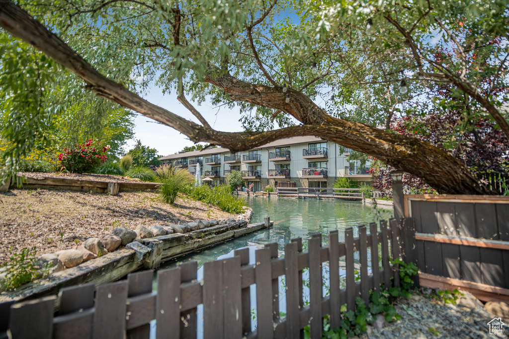 View of yard with a water view