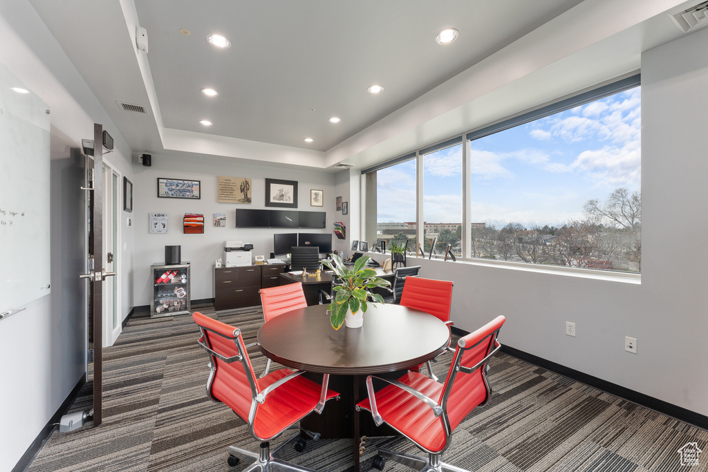 Dining space featuring baseboards, carpet floors, and visible vents