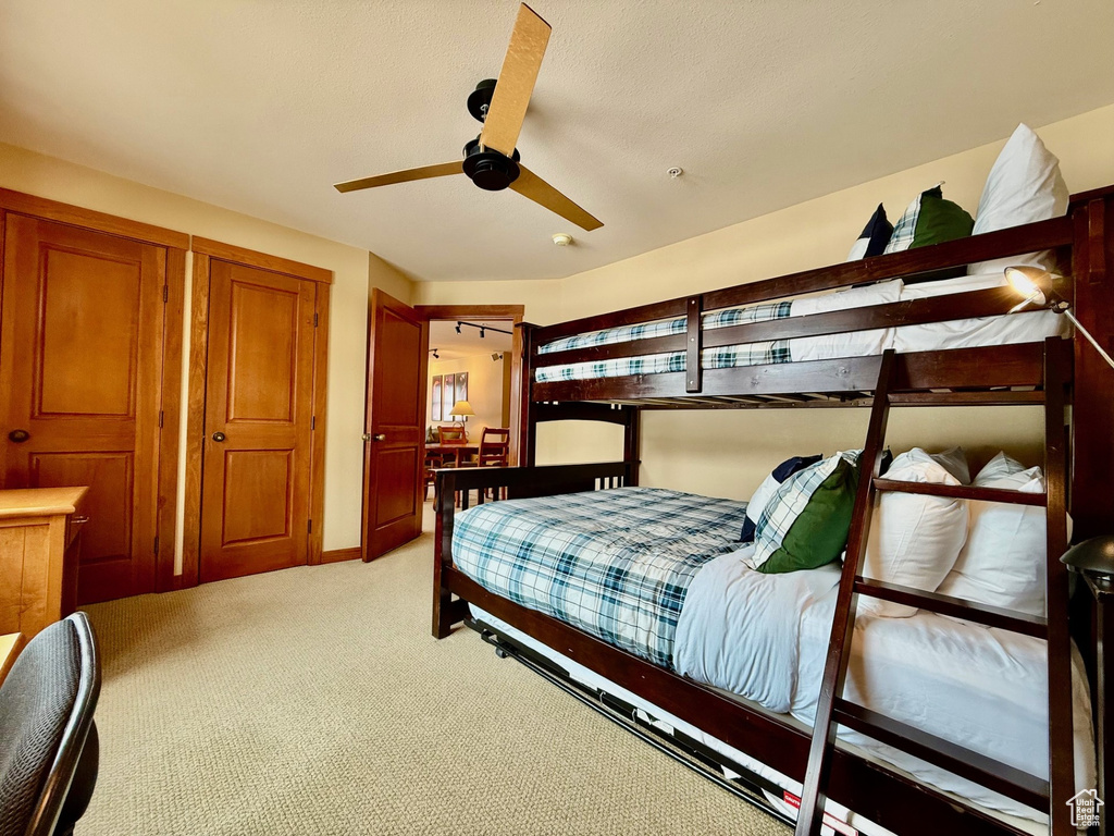 Bedroom featuring light carpet