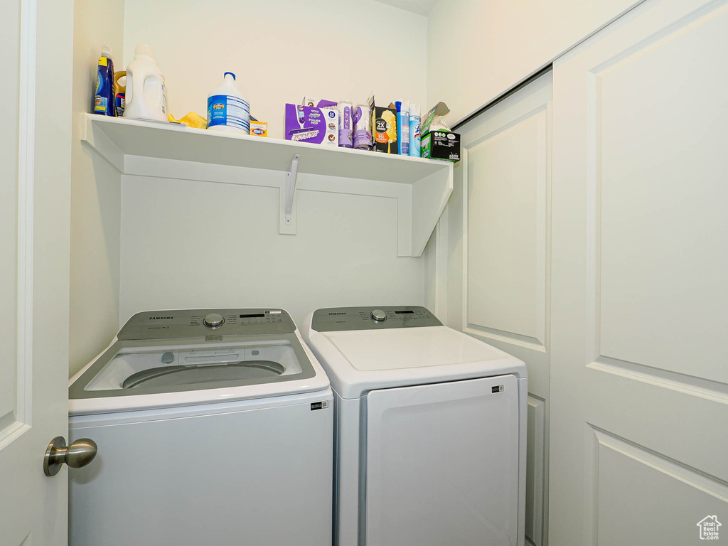 Clothes washing area with washer and clothes dryer