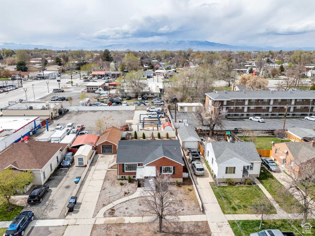 Birds eye view of property with a residential view and a mountain view