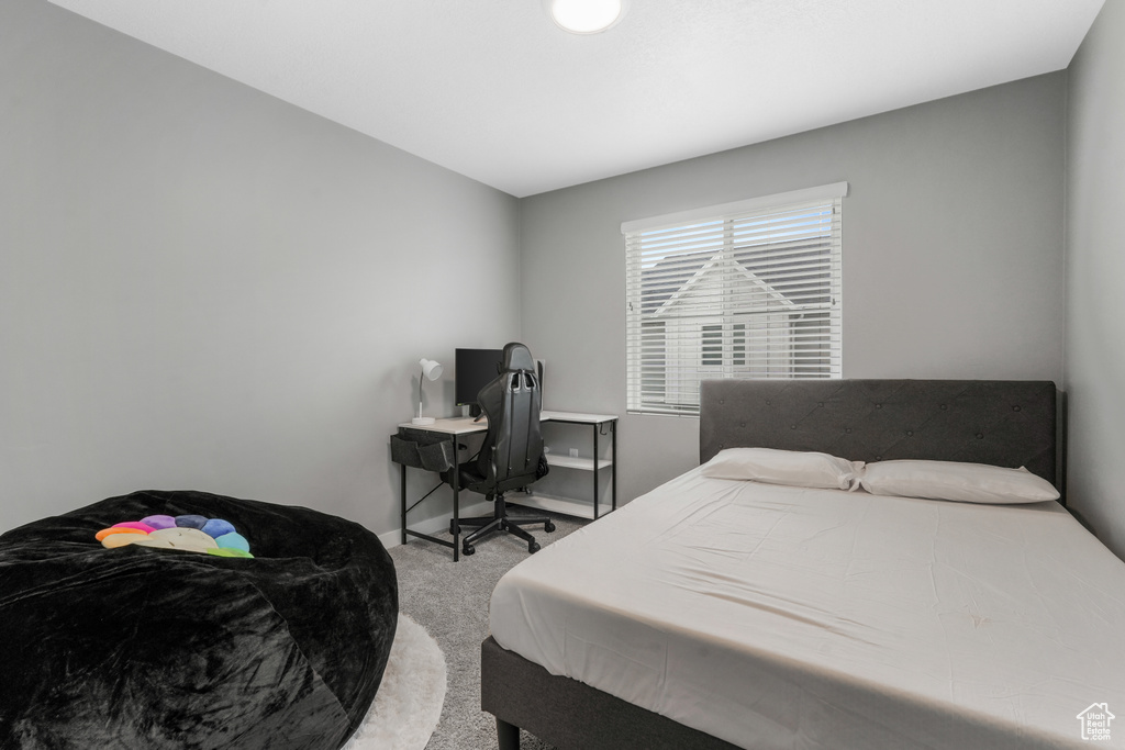 Bedroom featuring baseboards and carpet flooring