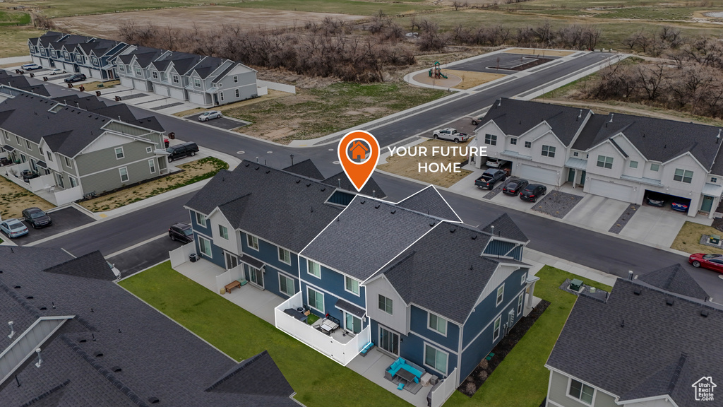 Birds eye view of property with a residential view