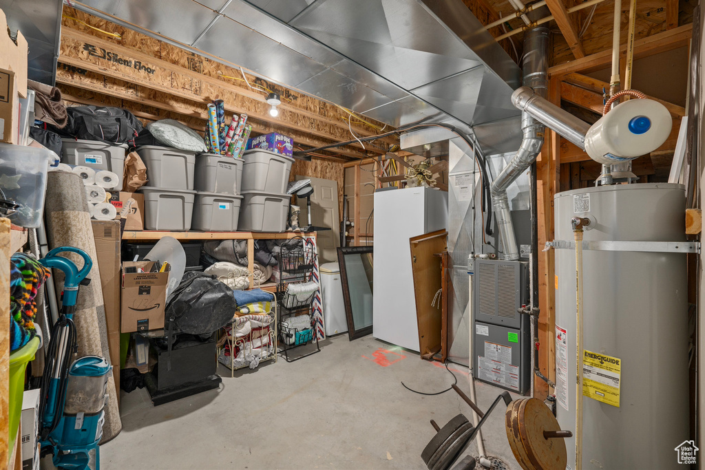 Unfinished below grade area with water heater and heating unit