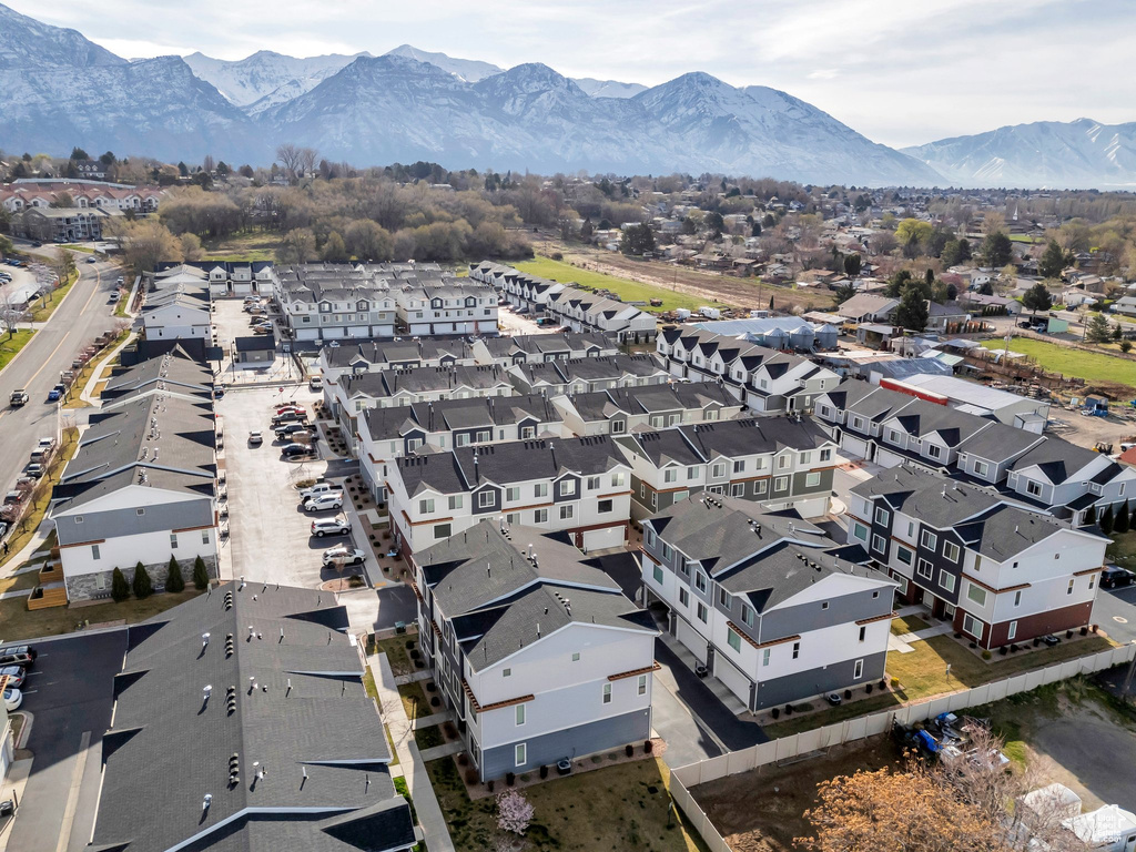 Birds eye view of property with a mountain view and a residential view