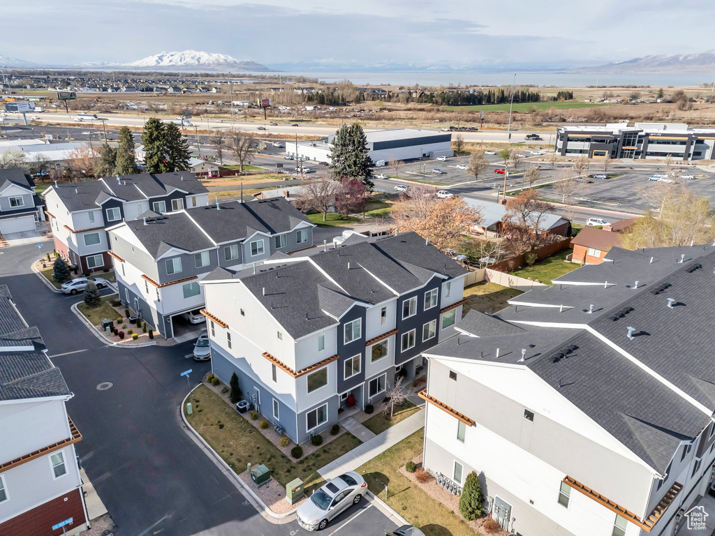 Birds eye view of property with a residential view and a mountain view