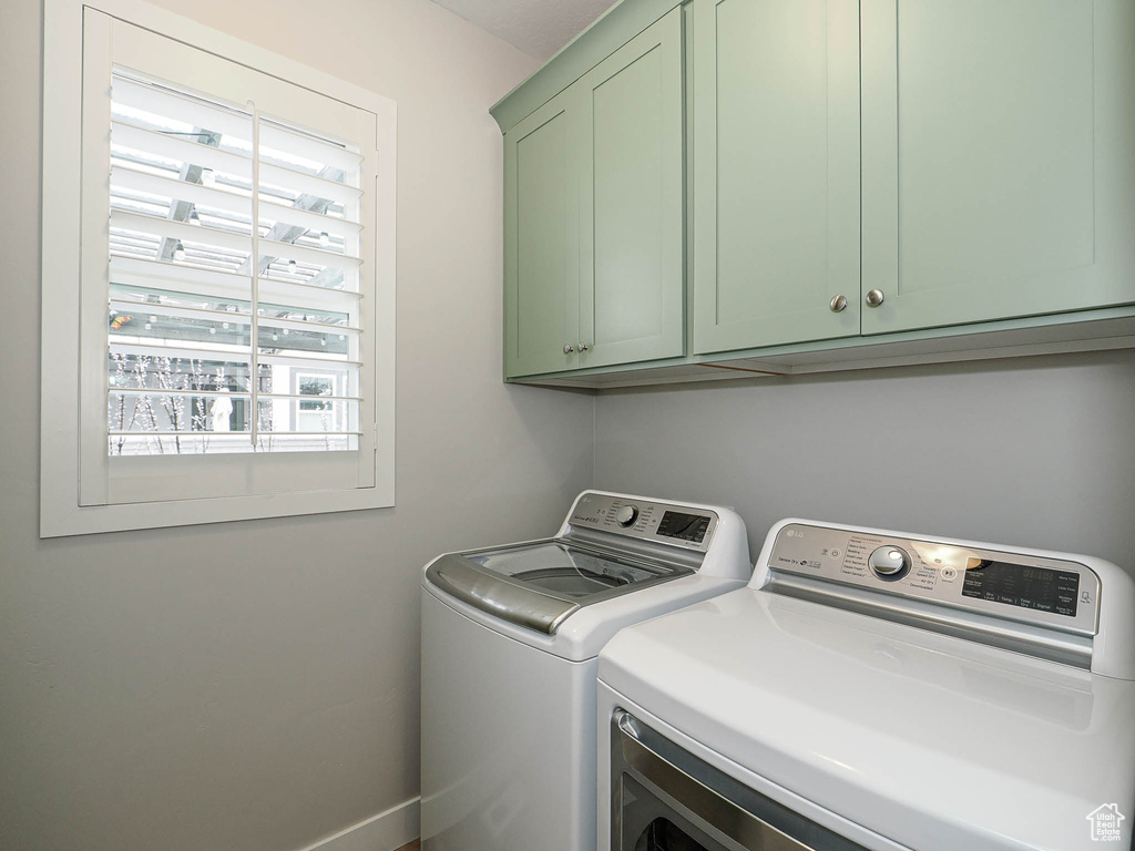 Laundry area with washing machine and dryer and cabinet space