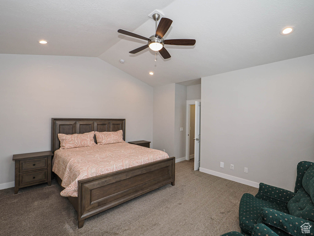 Bedroom with baseboards, ceiling fan, recessed lighting, vaulted ceiling, and light colored carpet