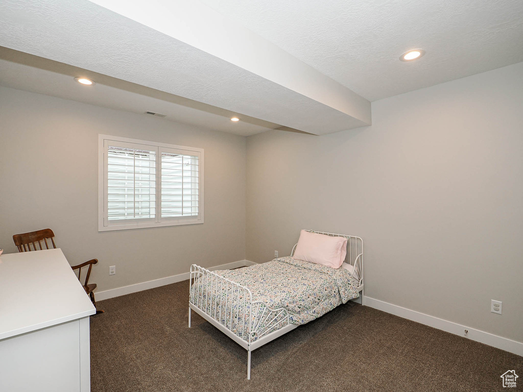 Bedroom with baseboards, dark colored carpet, and recessed lighting