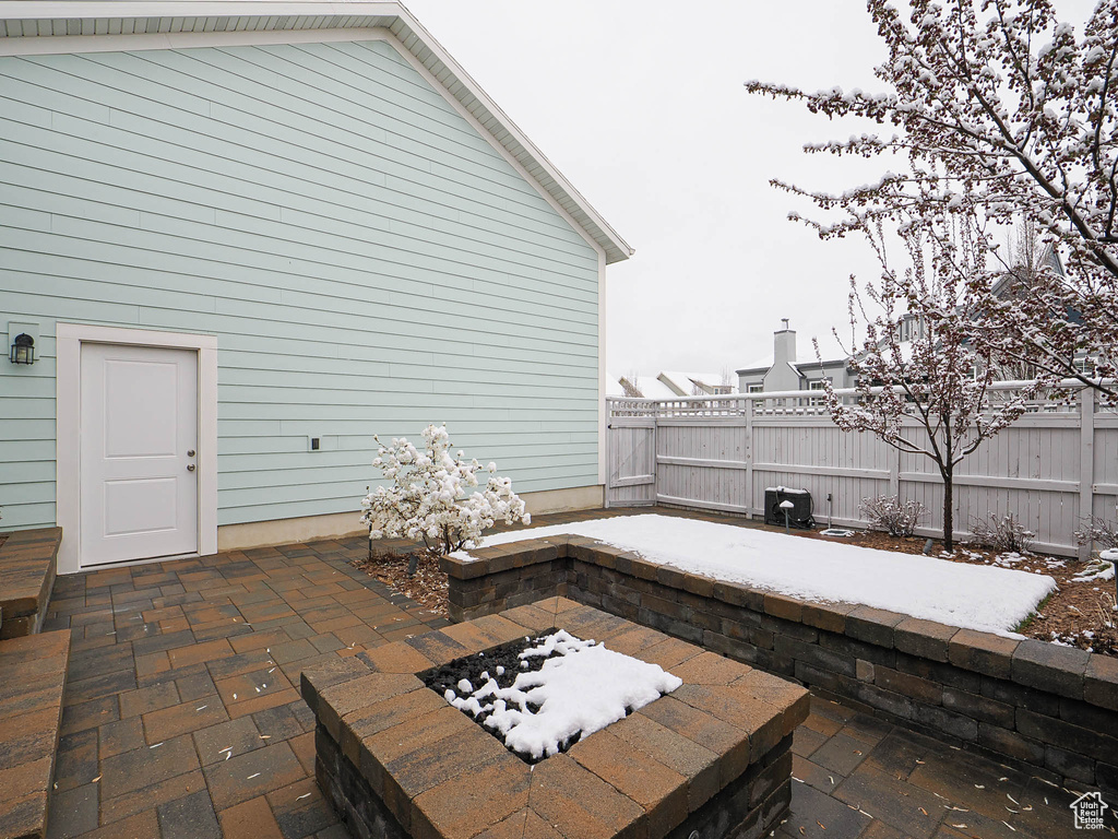 View of patio / terrace with fence and a fire pit