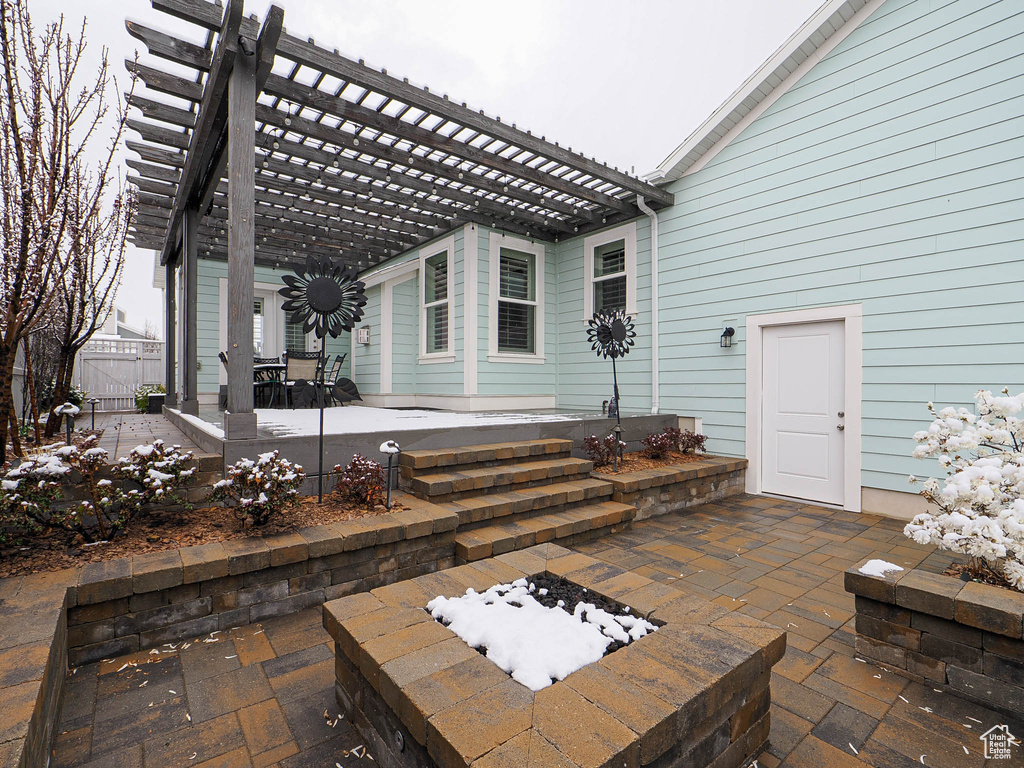 View of patio / terrace featuring a pergola, a fire pit, and fence