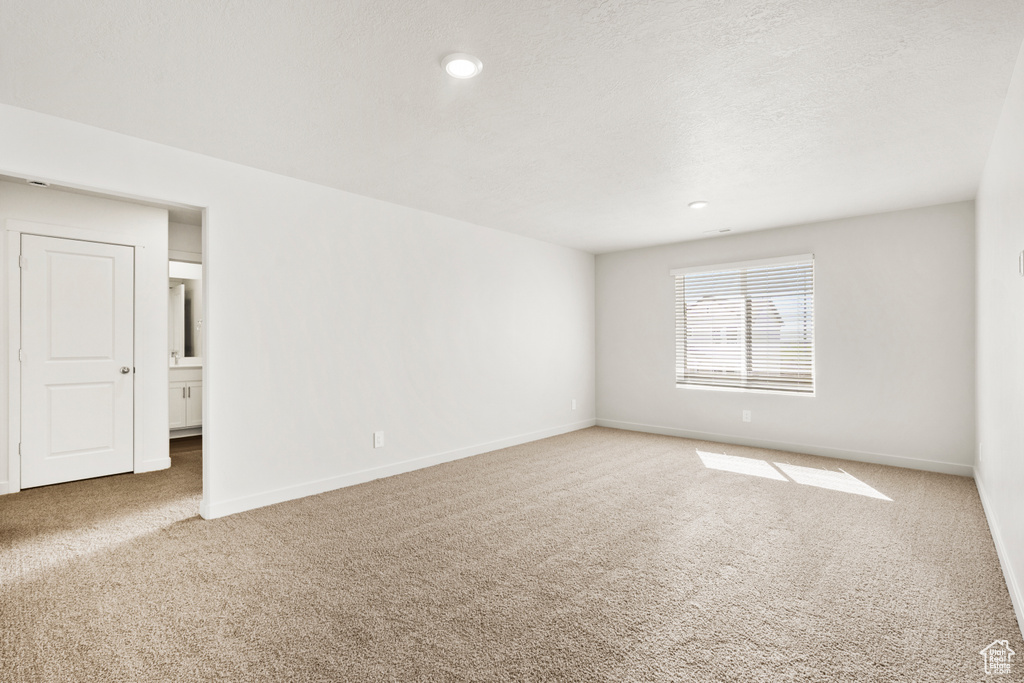 Unfurnished room with baseboards, recessed lighting, and carpet