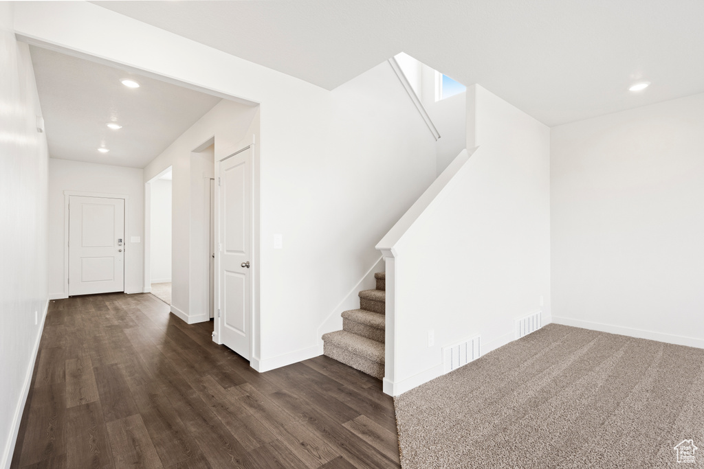 Interior space with visible vents, recessed lighting, baseboards, and wood finished floors