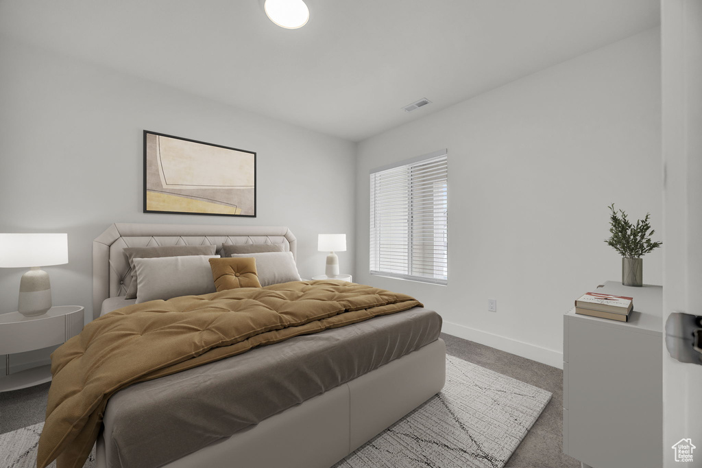 Carpeted bedroom featuring baseboards