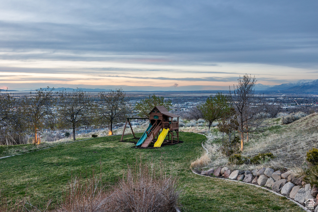 View of jungle gym with a yard