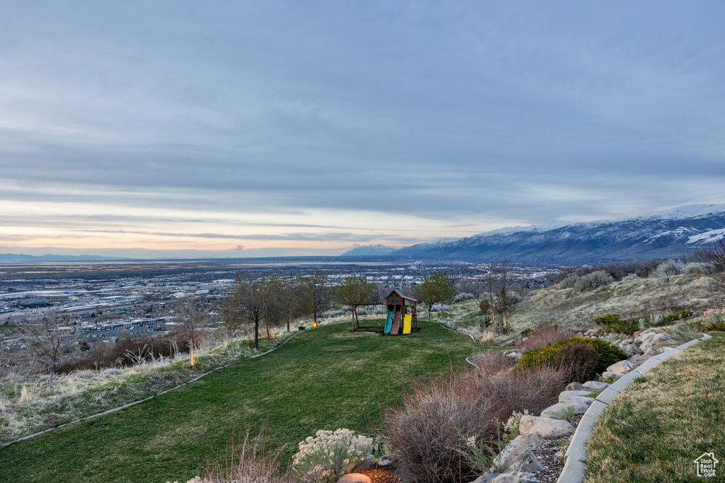 Exterior space featuring a mountain view and playground community