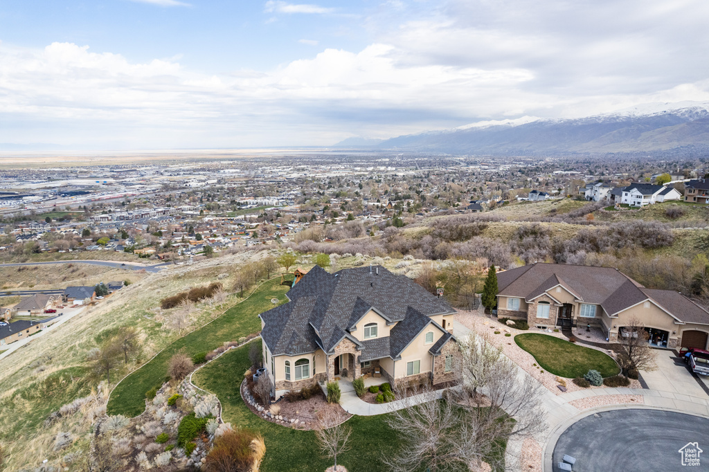 Birds eye view of property with a mountain view and a residential view