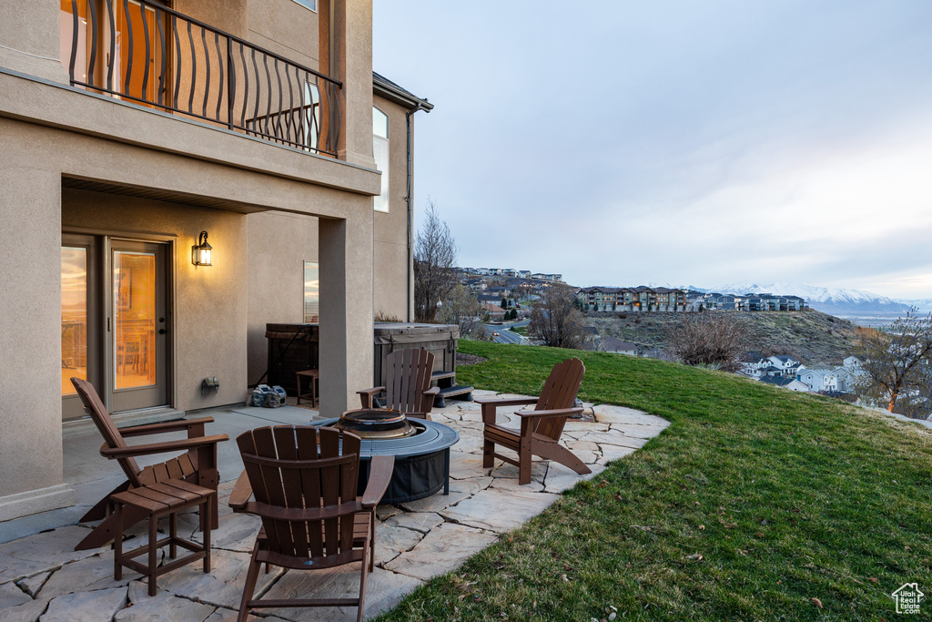 View of patio / terrace with a balcony and an outdoor fire pit