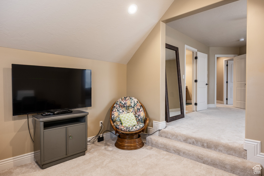 Interior space featuring baseboards and carpet flooring