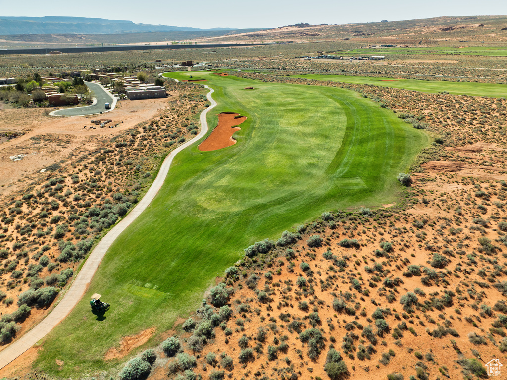 Birds eye view of property featuring view of golf course and a mountain view
