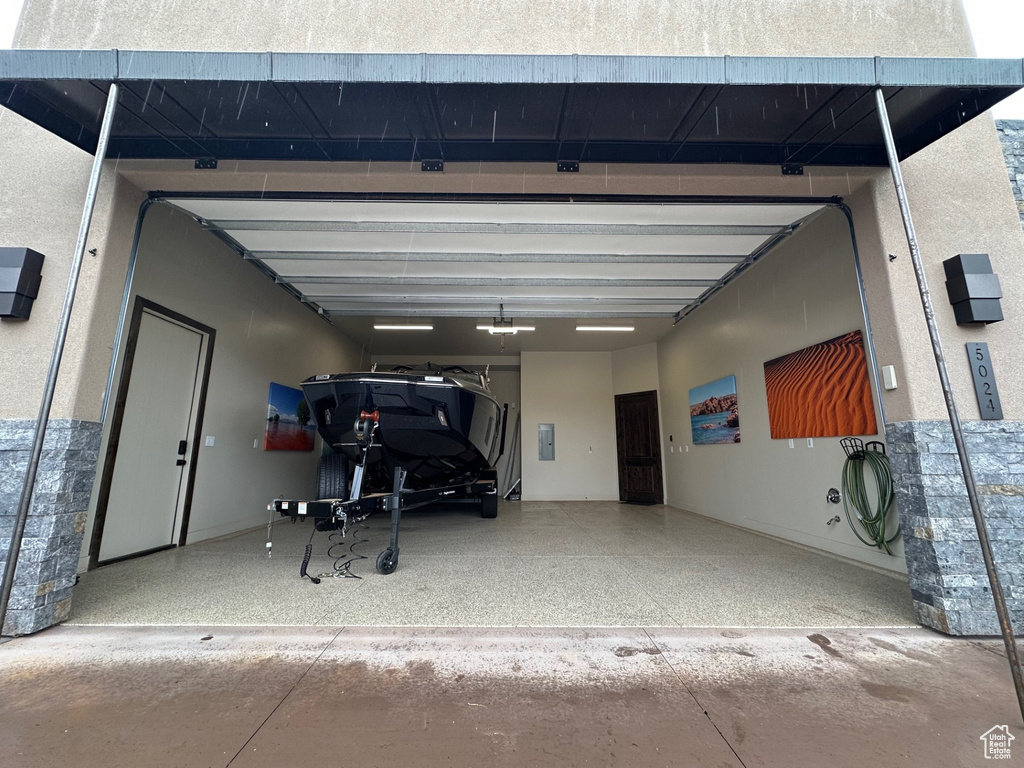 Garage featuring a garage door opener