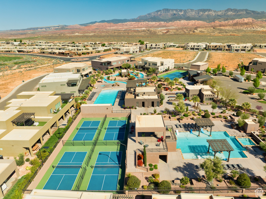 Birds eye view of property with a mountain view