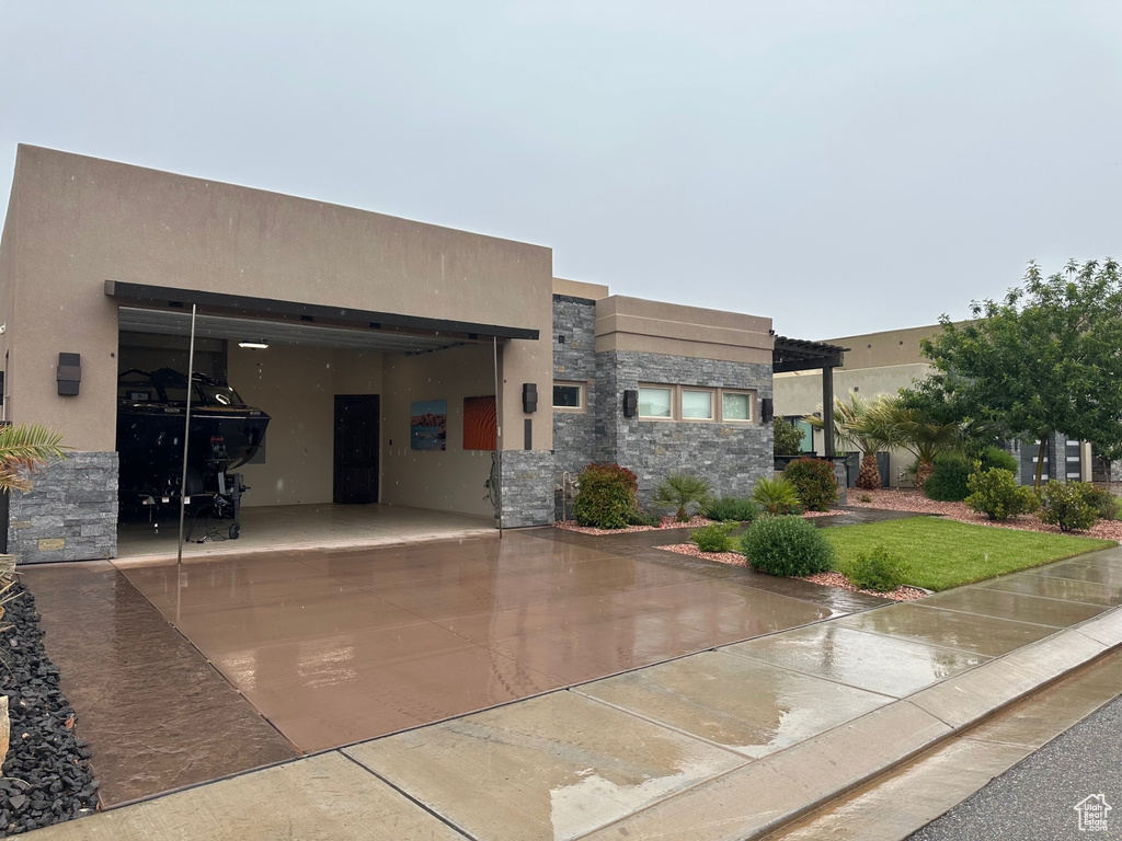 View of front facade with stone siding and stucco siding