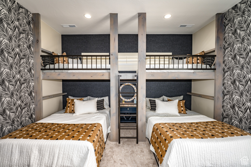 Carpeted bedroom featuring visible vents and recessed lighting