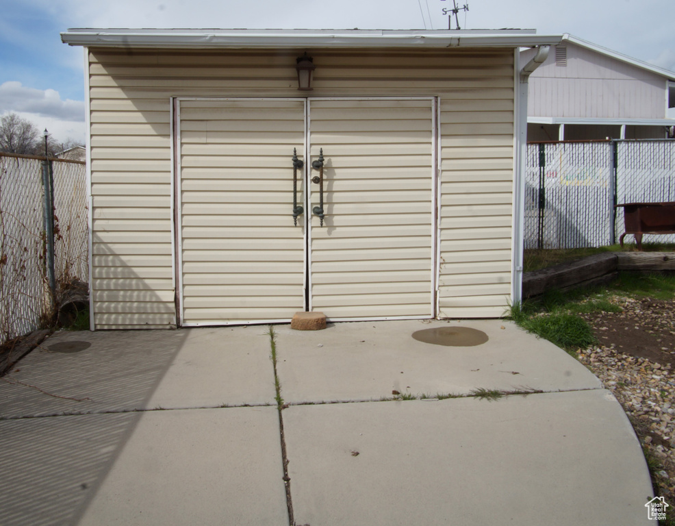 View of shed featuring a fenced backyard