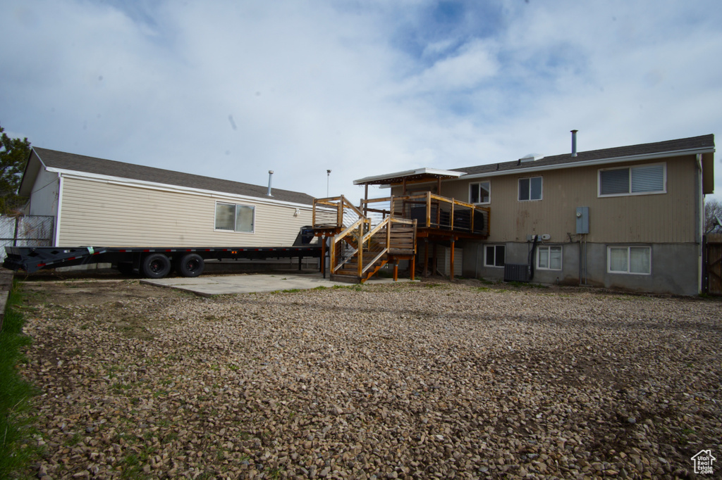 Back of property featuring stairs