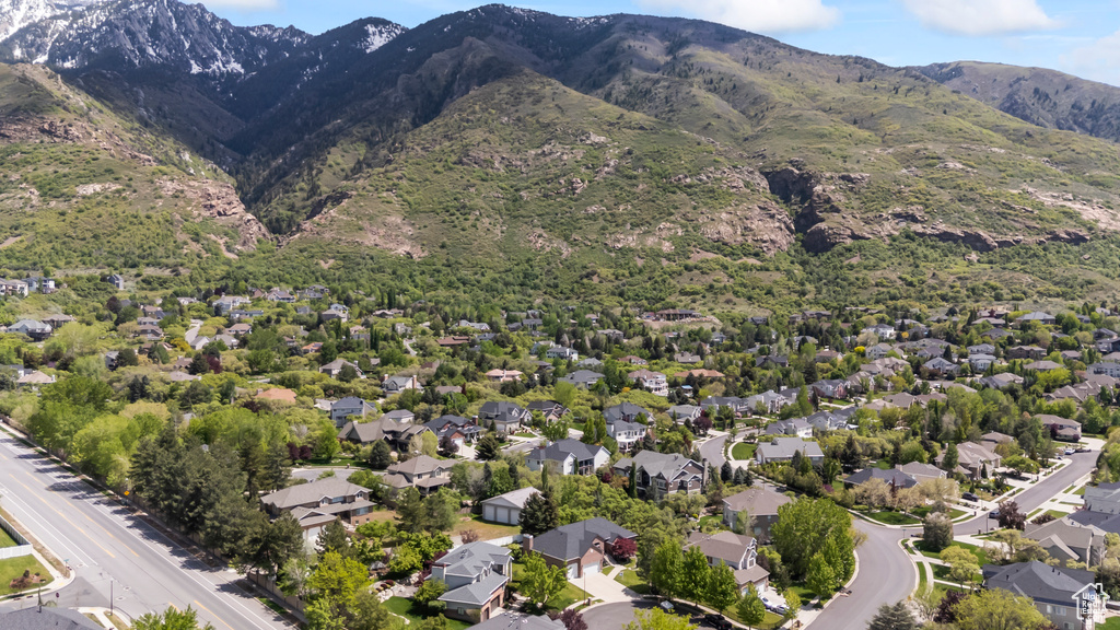 View of property location with mountains and nearby suburban area