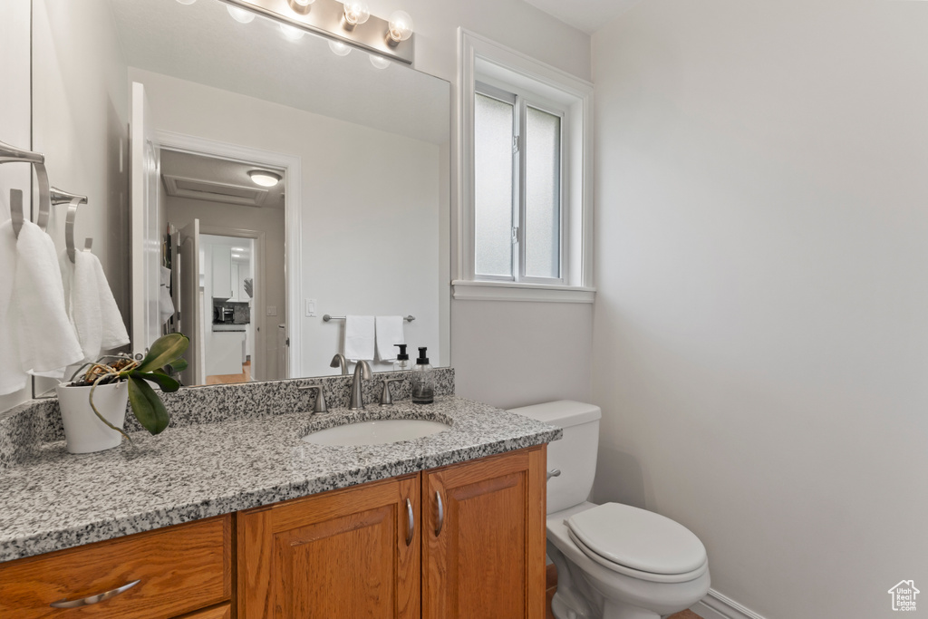 Bathroom with vanity and toilet