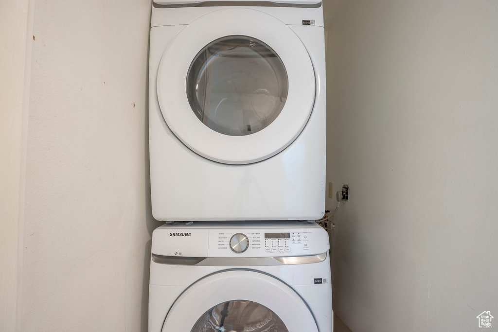 Laundry area featuring stacked washer / dryer