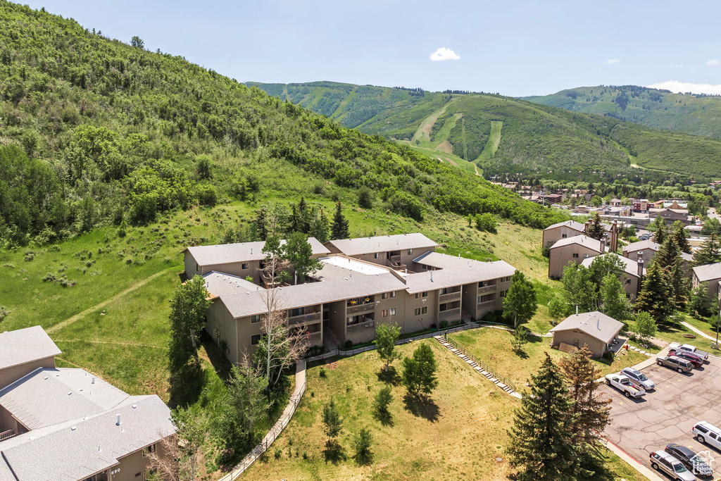 Aerial perspective of suburban area featuring a mountain backdrop