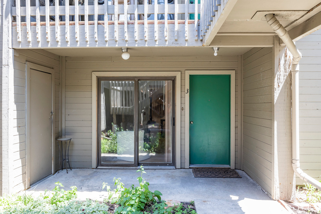 Doorway to property featuring a balcony