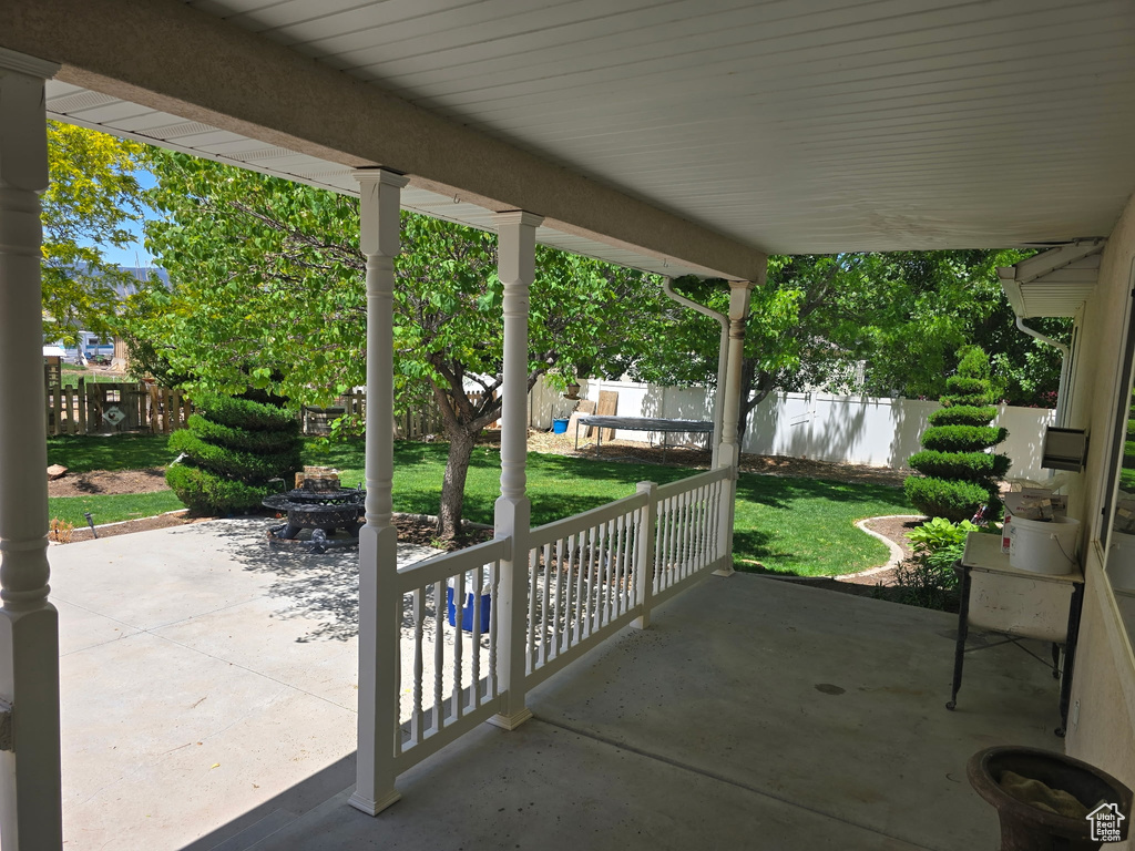 View of patio / terrace with an outdoor fire pit and a water view