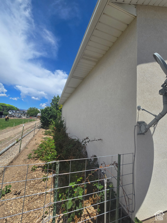 View of side of property featuring stucco siding